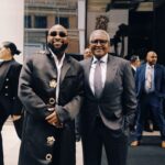 Davido and Dangote under Dangote Refinery billboard in Times Square